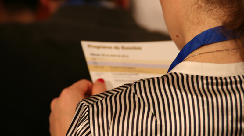 Participant reading the event program (2012)